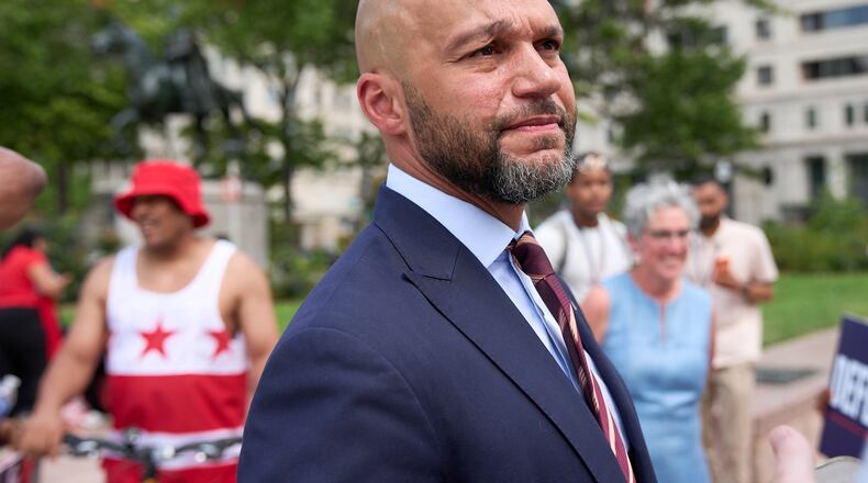 Congressional delegate candidate Robert White greets supporters after attending a news conference at Freedom Plaza in Washington, Monday, Aug. 24, 2026. (AP Photo/Jacquelyn Martin)