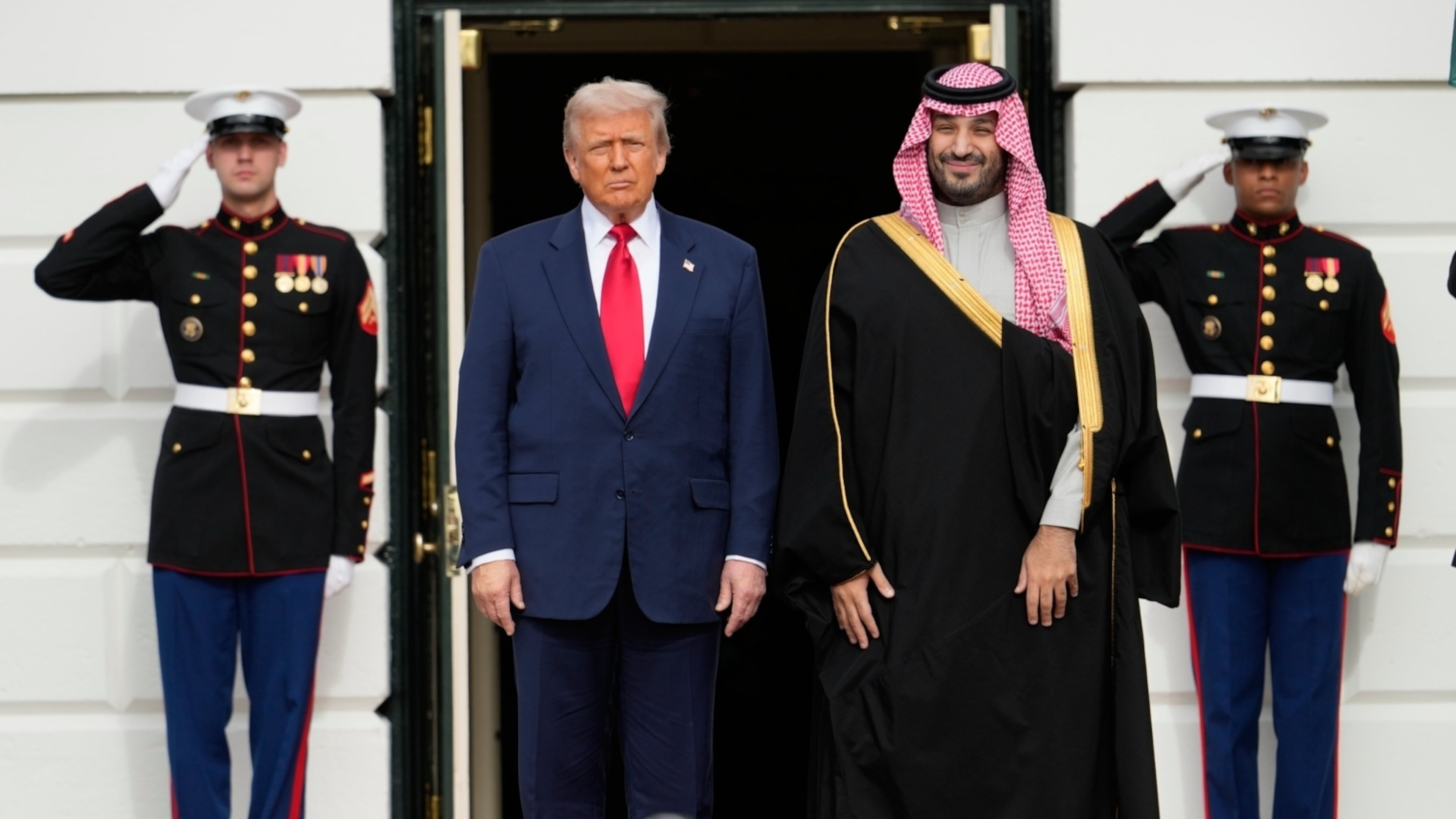 President Donald Trump stands with Saudi Arabia's Crown Prince Mohammed bin Salman on his visit to the White House, Tuesday, Nov. 18, 2025, in Washington. (AP Photo/Mark Schiefelbein)