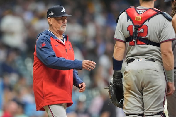 Atlanta Braves' Brian Snitker makes a pitching change during the sixth inning of a baseball game against the Milwaukee Brewers, Tuesday, June 10, 2025, in Milwaukee. (AP Photo/Aaron Gash)
