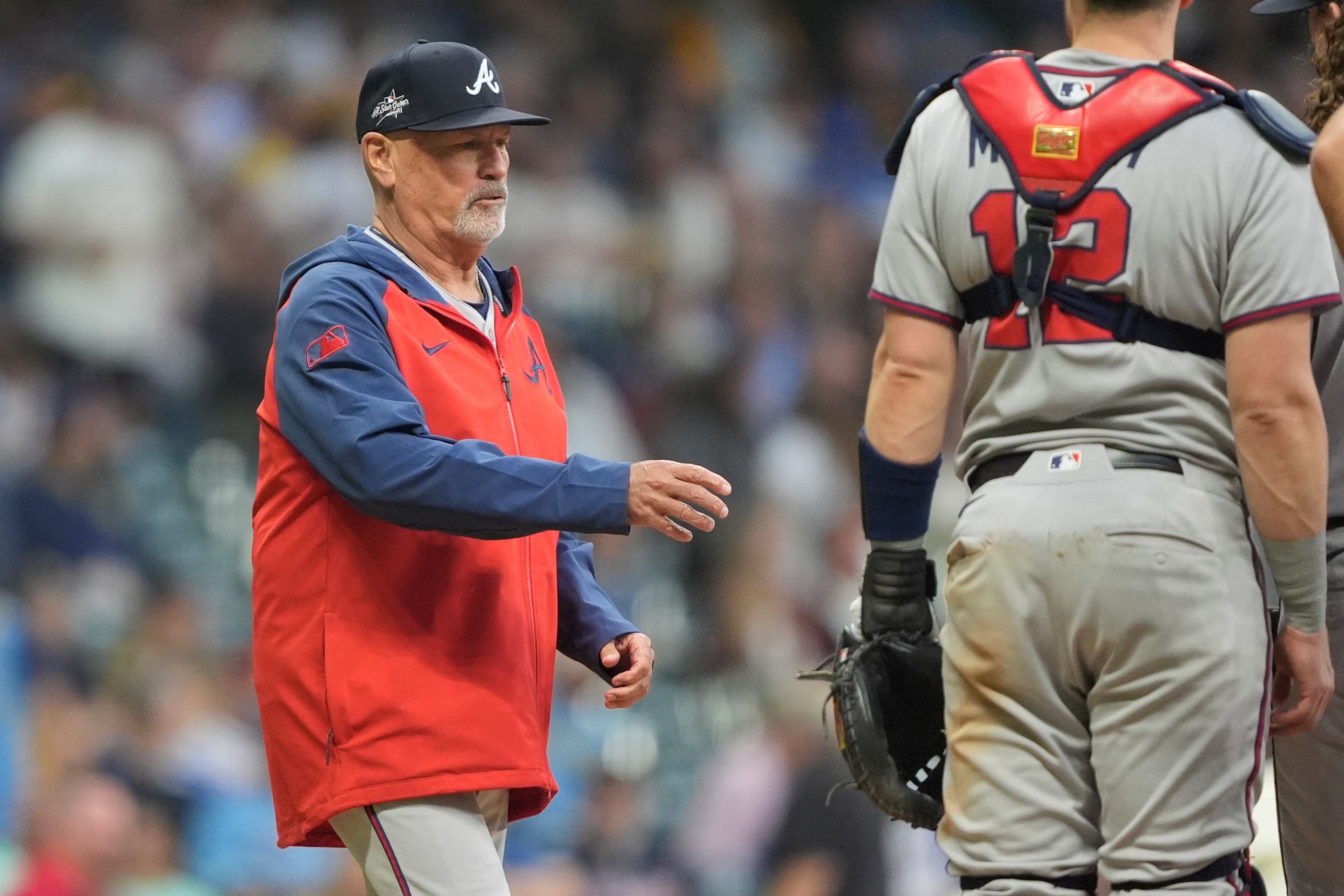 Atlanta Braves' Brian Snitker makes a pitching change during the sixth inning of a baseball game against the Milwaukee Brewers, Tuesday, June 10, 2025, in Milwaukee. (AP Photo/Aaron Gash)