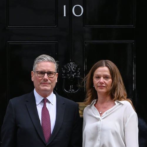 Britain's Prime Minister Keir Starmer and wife Victoria stand in front of 10 Downing Street door after after announcing his resignation in London, Monday, June 22, 2026.(AP Photo/Thomas Krych)