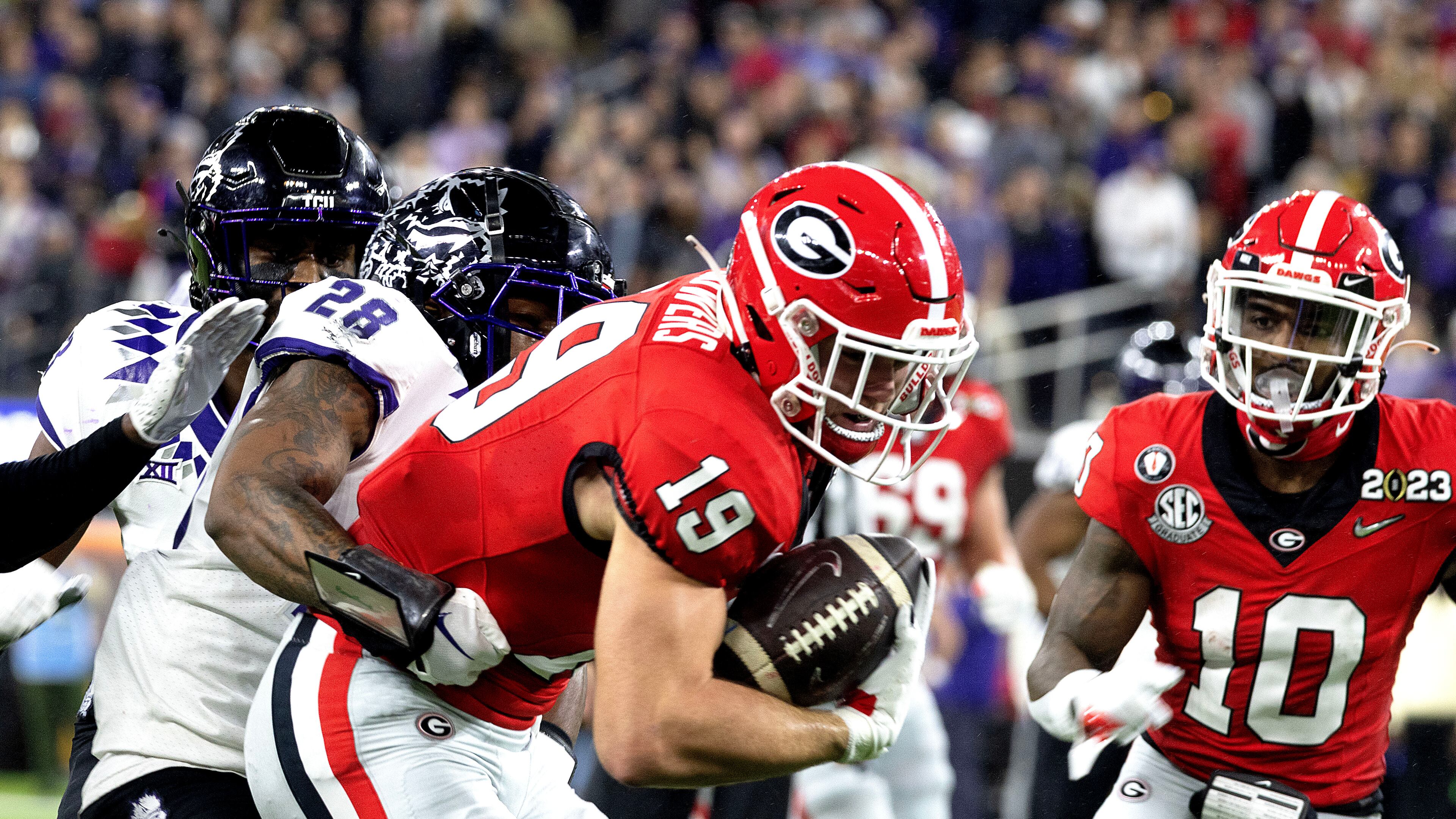 Former Georgia tight end Brock Bowers (center), shown here during the 2023 College Football Playoff national championship game, set team and league records last season in his rookie campaign with the Las Vegas Raiders. (AJC 2023)
