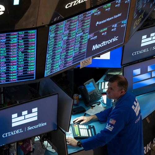 A screen shows stock prices on the floor of the New York Stock Exchange, Friday, Aug. 7, 2026, in New York. (AP Photo/Yuki Iwamura)