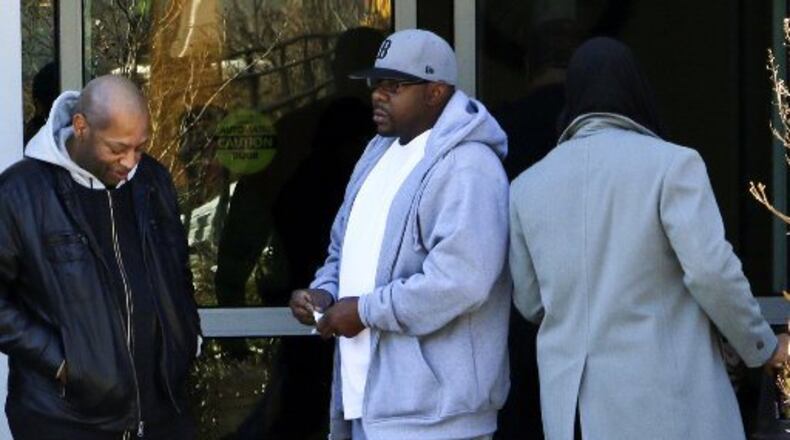 Entertainer Bobby Brown, center, at Emory Hospital in Atlanta when Bobbi Kristina Brown was there. She's since been moved to a long-term care facility. Photo: AP/Ron Harris