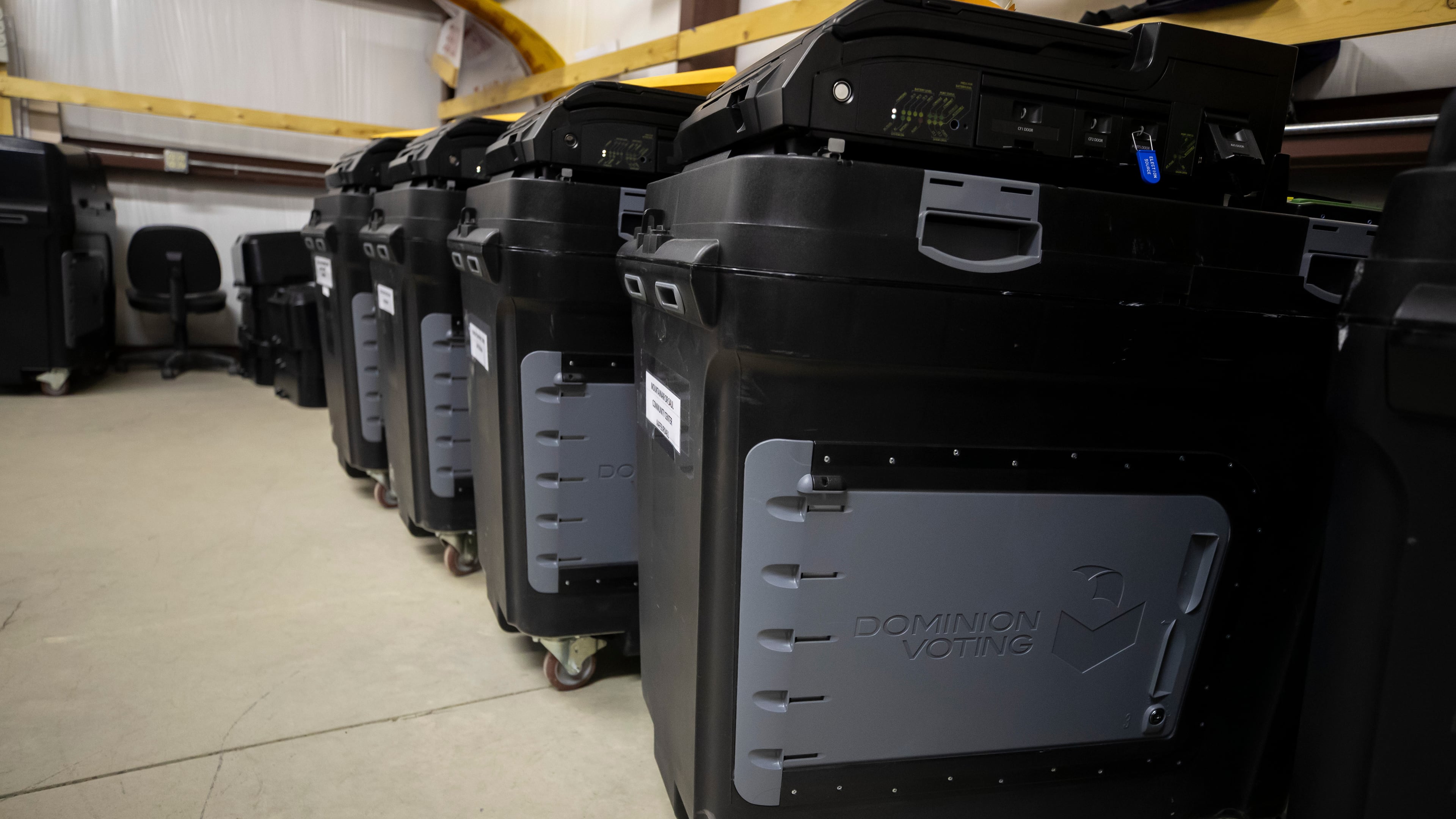 FILE - Dominion Voting ballot counting machines are lined up at a Torrance County warehouse during a testing of election equipment in Estancia, N.M., Sept. 29, 2022.(AP Photo/Andres Leighton, File)