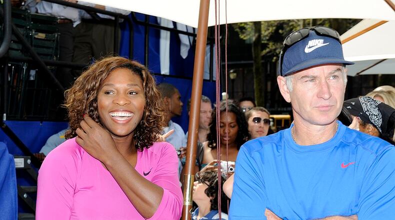 Serena Williams looks on with John McEnroe before their match at the DIRECTV ESPN US Open Experience promoting DIRECTV’s mosaic coverage of the US Open August 26, 2009 at Bryant Park in New York Cty. (Rob Tringali/Getty Images for DirecTV)