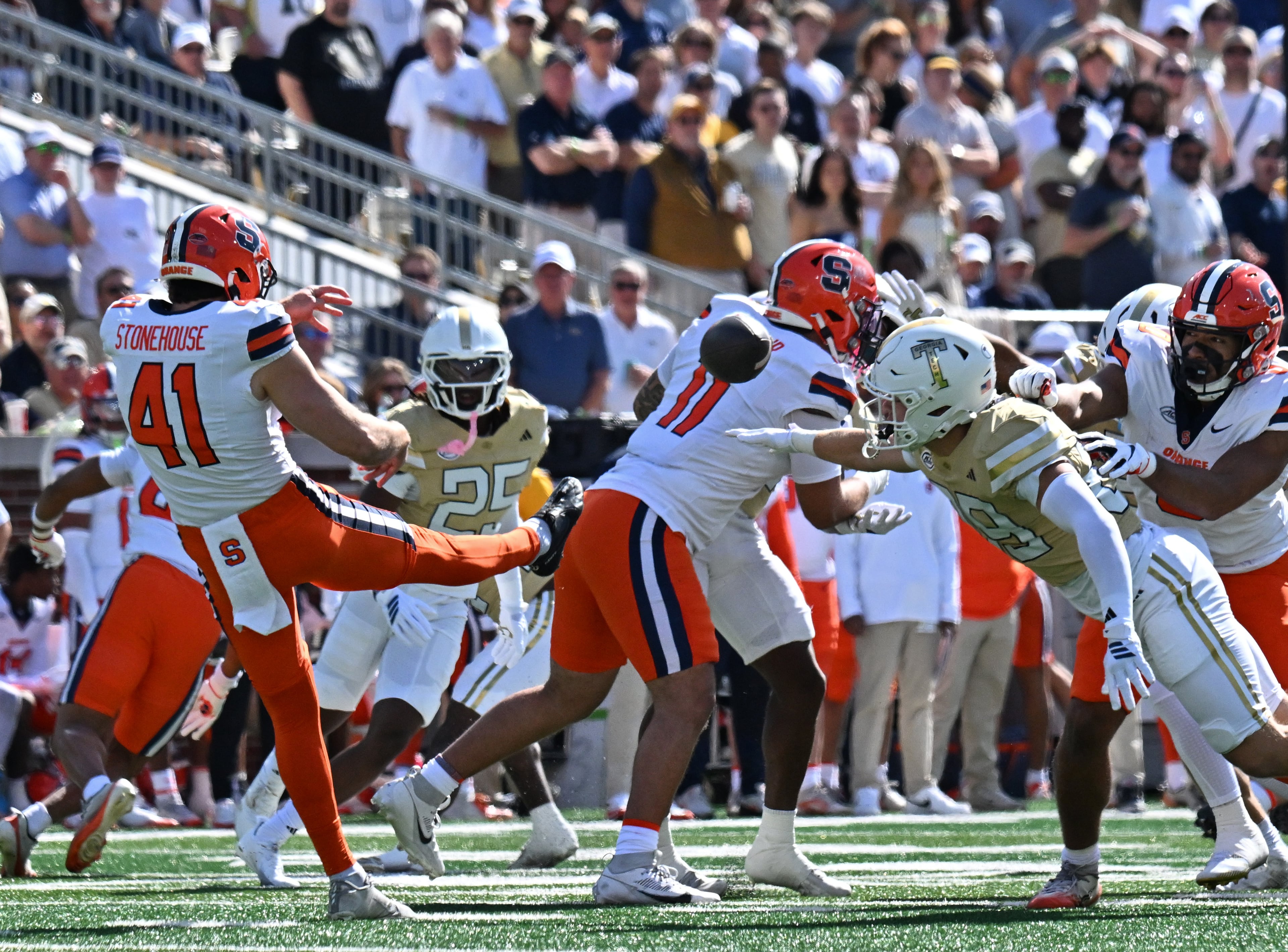 Syracuse punter Jack Stonehouse (41) kicks as Georgia Tech wide receiver Chris Elko (89) tries to block during the first half of an NCAA college football game at Bobby Dodd Stadium, Saturday, October 25, 2025 in Atlanta. (Hyosub Shin / AJC)