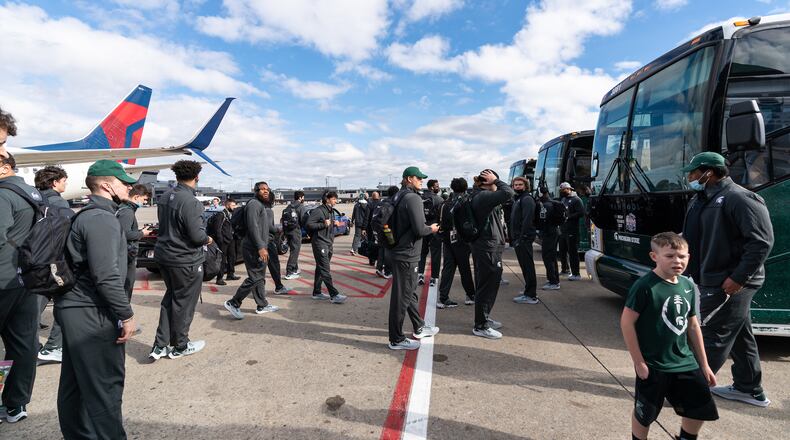 Michigan State arrives at Hartsfield-Jackson Atlanta International Airport for the Chick-fil-A Peach Bowl NCAA college football game Friday, Dec. 24, 2021, in Atlanta, Ga. Michigan State will face Pitt in the game on Dec.30, 2021. (Paul Abell via Abell Images for the Chick-fil-A Peach Bowl)