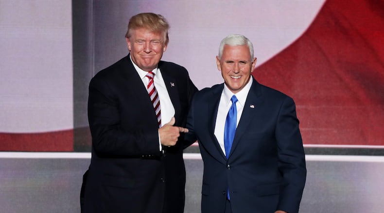 Donald Trump stands with Mike Pence. (Photo by Alex Wong/Getty Images)