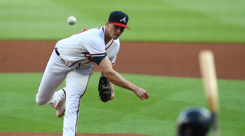 Braves pitcher Kyle Wright delivers against the Red Sox. Wright and his peers face a challenge many of those who played before them never did: social media’s dark side. It allows anyone and everyone to have a voice, even those who decide to remain anonymous. (Curtis Compton / Curtis.Compton@ajc.com)