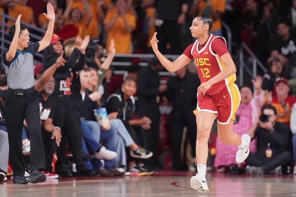 FILE - Southern California guard JuJu Watkins gestures after scoring during the first half of an NCAA college basketball game against the UCLA, Thursday, Feb. 13, 2025, in Los Angeles. (AP Photo/Mark J. Terrill, File)