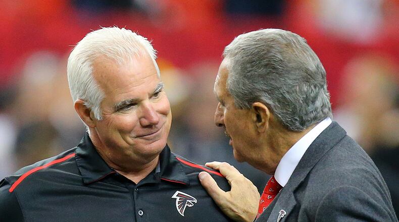 121414 ATLANTA: Falcons head coach Mike Smith and team owner Arthur Blank greet each other before playing the Steelers in a football on Sunday, Dec. 14, 2014, in Atlanta. CURTIS COMPTON / CCOMPTON@AJC.COM Will Mike Smith and Arthur Blank meet again next season? (Curtis Compton, AJC)