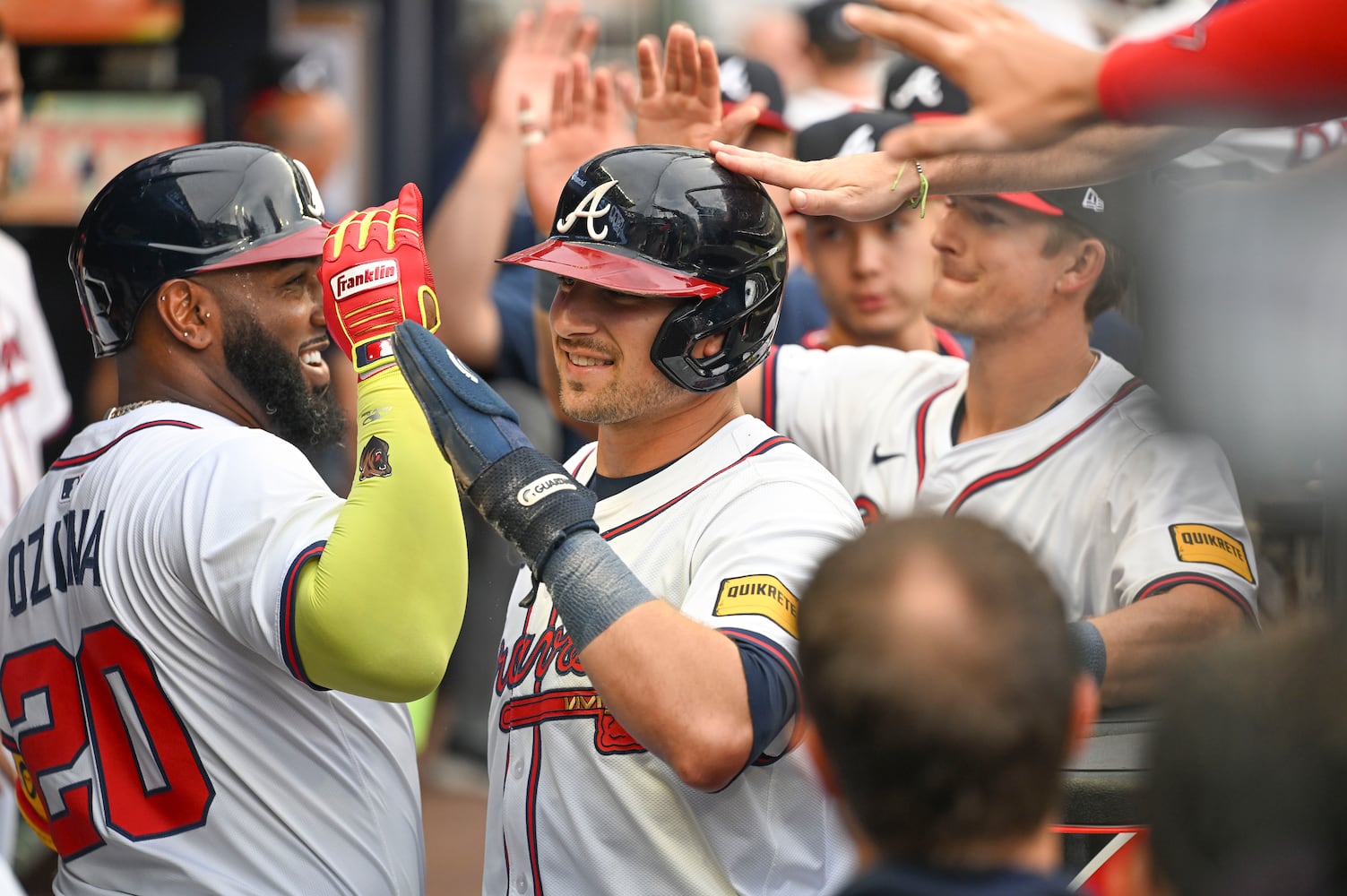 Atlanta Braves third base Austin Riley (27) is congratulated by teammates after scoring on a sacrifice fly ball in the first inning during a MLB game Wednesday, June 18, 2025 at Truist Park. (Daniel Varnado/For the Atlanta Journal-Constitution)