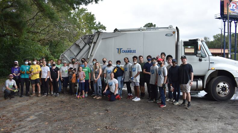 More than 60 volunteers helped clean Nancy Creek in Chamblee of 1.4 tons of debris in mid-October - much of it recyclable. Of DeKalb residents, 60% are signed up for the county's free Residential Single-stream Recycling Program. (Courtesy of Chamblee)