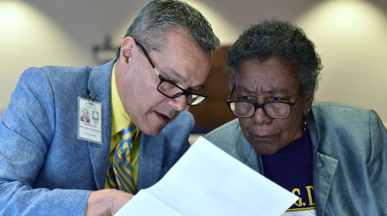 Emil Schultz (left), appraiser, helps Fulton County resident Marie F. Blake with her annual notice of assessment during Emergency Town Hall Meeting to discuss about Property Tax Assessments hosted by Fulton County Office of Chairman John Eaves at Harriett G. Darnell Senior Multipurpose Facility on Tuesday, June 13, 2017. HYOSUB SHIN / HSHIN@AJC.COM