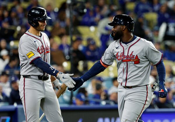 Braves first baseman Matt Olson (left) congratulates outfielder Michael Harris II on his homer against the Dodgers.