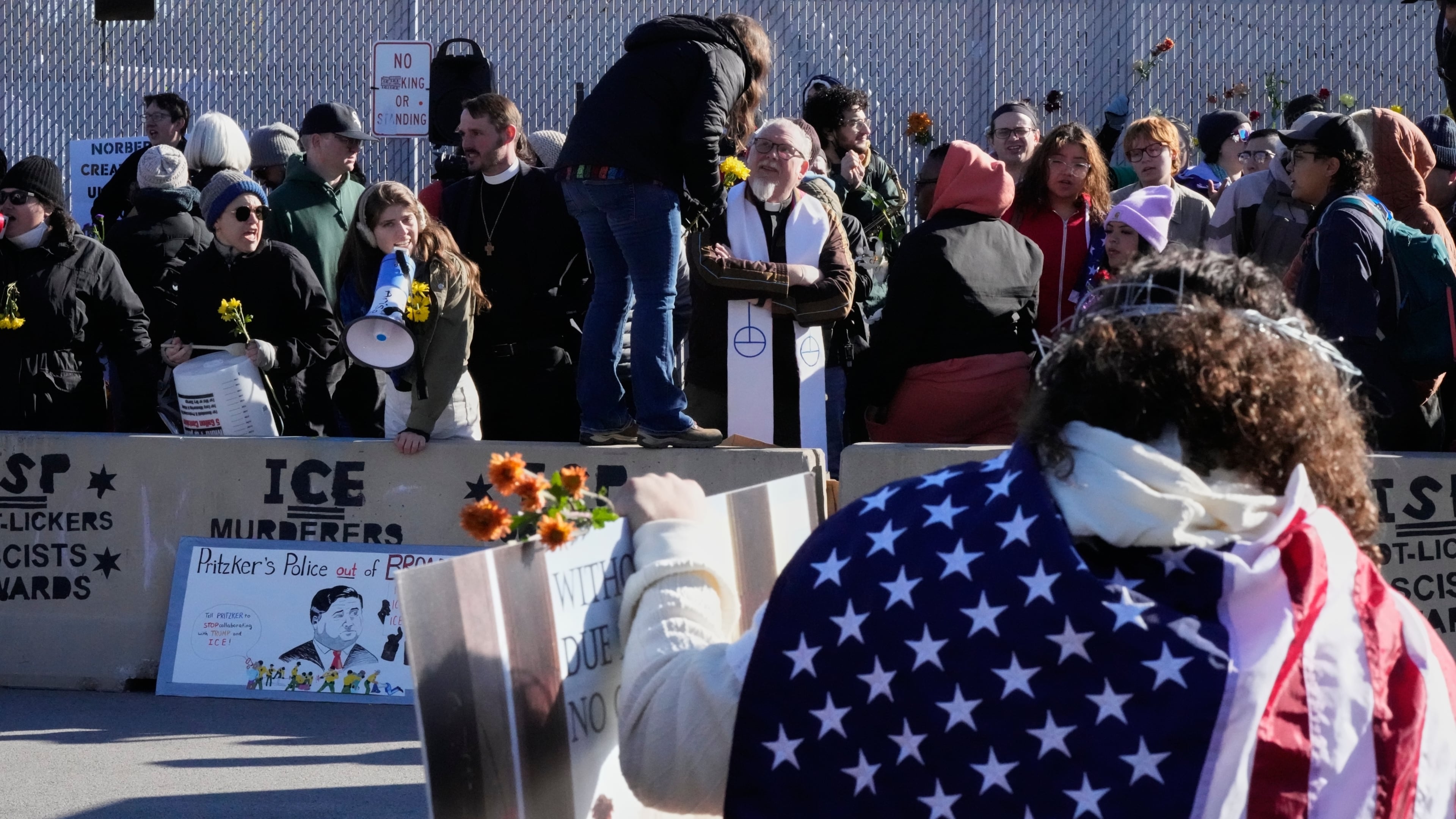 Protesters gather outside an ICE processing facility in Broadview, Ill. a suburb of Chicago, Friday, Oct. 24, 2025. (AP Photo/Nam Y. Huh)