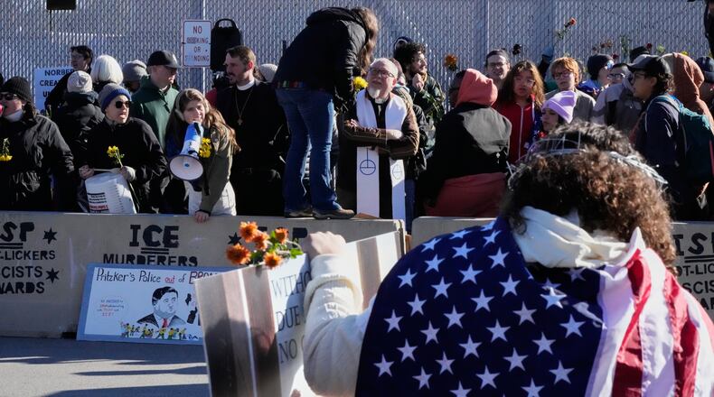 Protesters gather outside an ICE processing facility in Broadview, Ill. a suburb of Chicago, Friday, Oct. 24, 2025. (AP Photo/Nam Y. Huh)