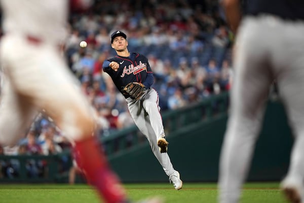 Atlanta Braves shortstop Luke Williams throws to first base after fielding a single by Philadelphia Phillies' Kyle Schwarber during the eighth inning in the second baseball game of a doubleheader Thursday, May 29, 2025, in Philadelphia. (AP Photo/Matt Slocum)