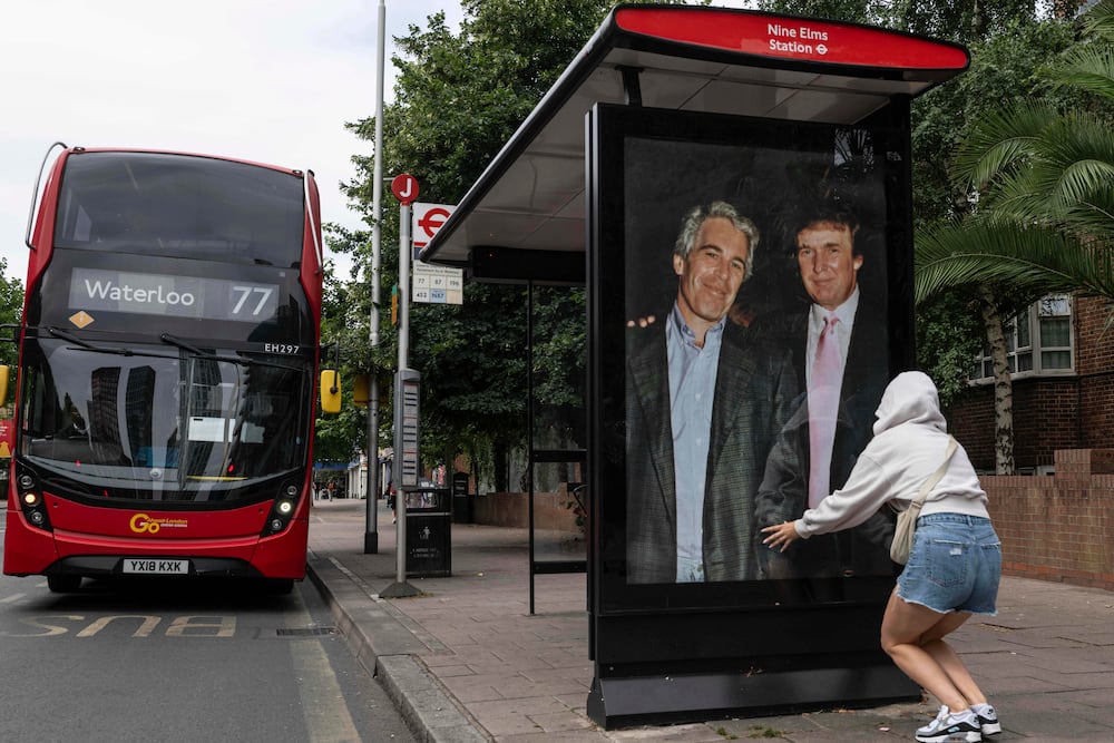 Activists put up a poster of accused sex trafficker Jeffrey Epstein (left) and President Donald Trump near the U.S. Embassy in London last week.