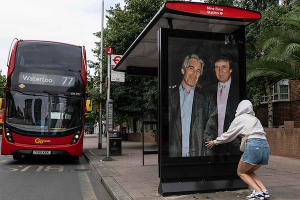 Activists put up a poster of accused sex trafficker Jeffrey Epstein (left) and President Donald Trump near the U.S. Embassy in London last week.