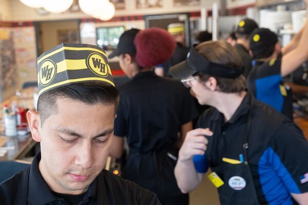 Area Vice President Diego Huerta works behind the counter at the Waffle House on Peachtree Road in Brookhaven on Friday, Aug. 14, 2026. (Ben Gray for the AJC)