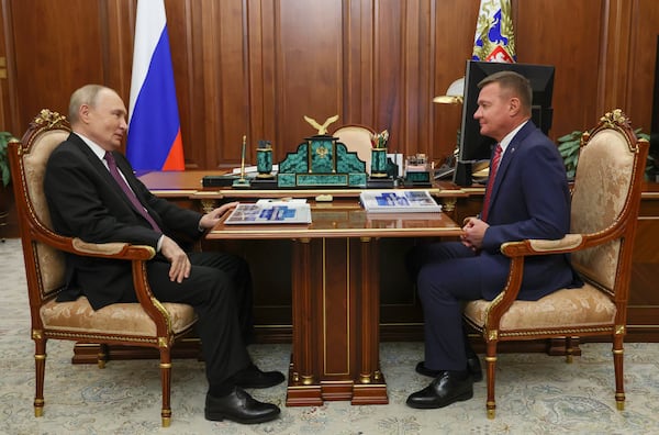 FILE - Russian President Vladimir Putin, left, meets with Russian Transport Minister Roman Starovoyt at the Kremlin in Moscow, Russia, Thursday, Jan. 30, 2025. (Gavriil Grigorov, Sputnik, Kremlin Pool Photo via AP, File)