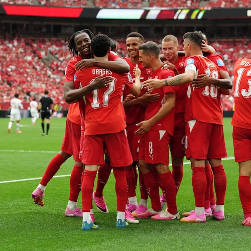 Switzerland's Ruben Vargas (17) is mobbed by teammates after scoring their first goal during the World Cup Group B soccer match between Switzerland and Canada in Vancouver, British Columbia, Wednesday, June 24, 2026. (Ethan Cairns/The Canadian Press via AP)