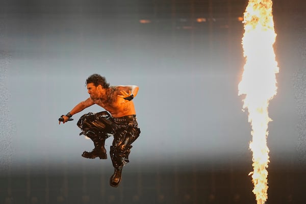 PARG from Armenia performs the song "SURVIVOR" during the dress rehearsal for the Grand Final of the 69th Eurovision Song Contest, in Basel, Switzerland, Friday, May 16 2025. (AP Photo/Martin Meissner)