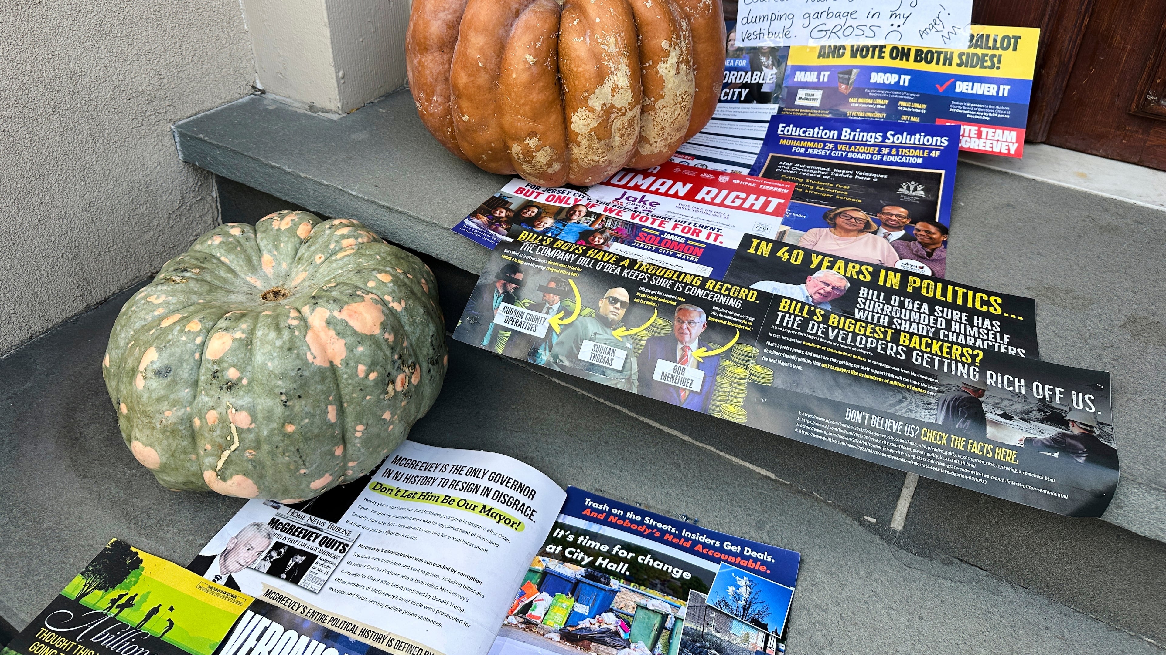 A Halloween display of unwanted campaign fliers sits in front of a private home in The Heights neighborhood of Jersey City, N.J, Thursday, Oct. 23, 2025. (AP Photo/Robert Yoon)