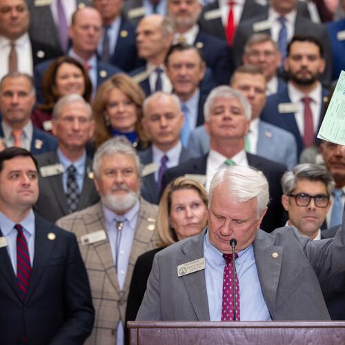 House Speaker Jon Burns holds up proposed property tax relief legislation during a press conference at the Capitol in Atlanta on Wednesday, Jan. 28, 2026. (Arvin Temkar /Atlanta Journal-Constitution via AP)
