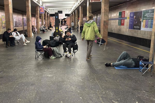 People take shelter at Kontraktova Ploshcha subway station during a Russian drone and missile attack in Kyiv, Ukraine, Saturday, May 24, 2025. (AP Photo/Illia Novikov)
