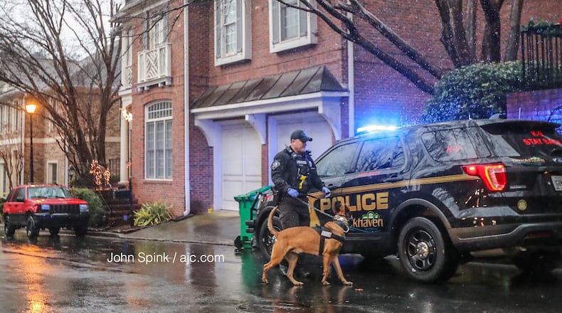 Brookhaven police officers search a home on Hedge Road Court for narcotics Thursday morning. The North Metro SWAT unit was called in to make an initial sweep of the residence.