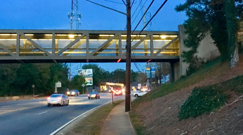 Construction of the E.co East project begins in December in the Avondale MARTA parking lot to the right, or south, of this College Avenue overpass. The delopment is projecting 345 market rate apartments and 95 affordable senior independent living units. The overpass will be renovated and incorporated into the project as bicycle/pedestrian track. Bill Banks for the AJC