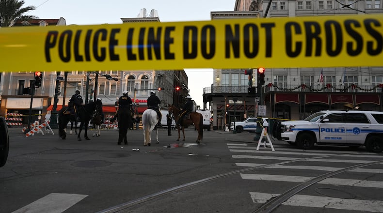 Several law enforcement agencies are seen around Bourbon Street, where a vehicle drove into a crowd in an attack that killed at least 15 people and injured dozens more on Wednesday, January 1, 2025, in the French Quarter of New Orleans, LA. (Hyosub Shin / AJC)