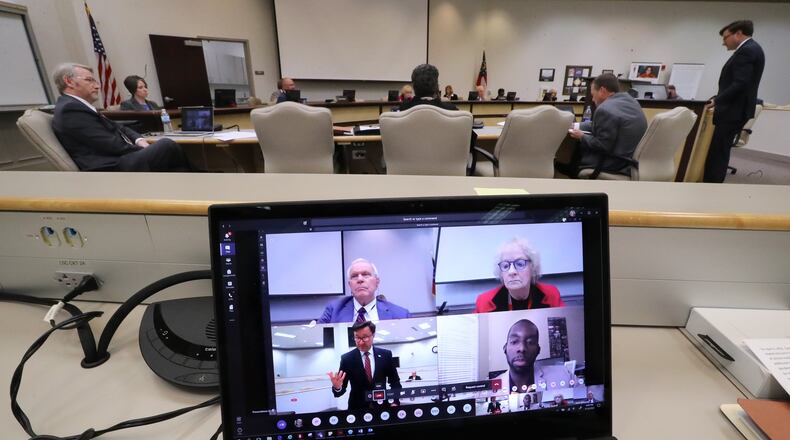 The Gwinnett County Board of Education, which oversees the largest school district in the state, conducts its first work session and budget meeting in cyberspace at the Gwinnett County Public Schools Instructional Support Center in April. During the virtual school board meeting the public sees at home on their screens chief executive officer J. Alvin Banks (clockwise from upper left), chair Louise Radloff, associate superintendent Jonathan Patterson, and participating from home board member Everton Blair. Curtis Compton ccompton@ajc.com
