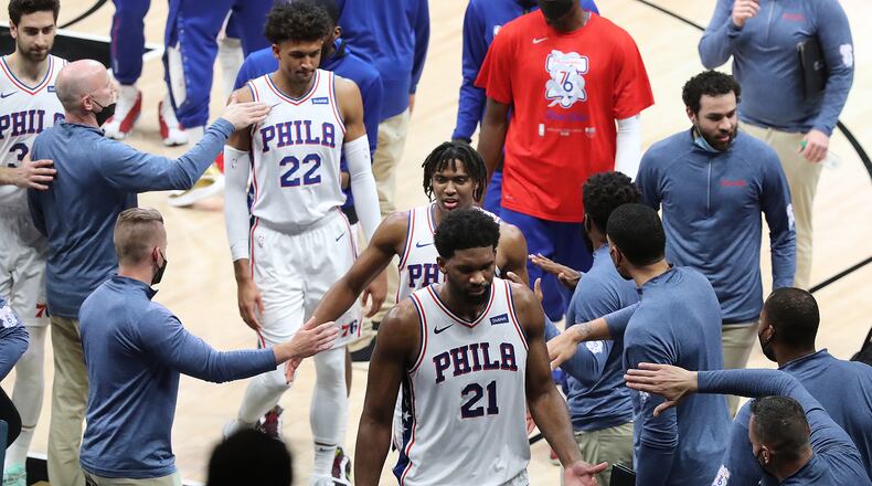 76ers center Joel Embiid and teammates leave with a 104-99 victory over the Atlanta Hawks in Game 6 of their NBA Eastern Conference semifinals series.   “Curtis Compton / Curtis.Compton@ajc.com”