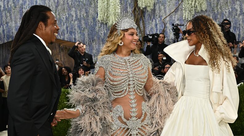 Jay-Z, from left, Beyoncé, and, Blue Ivy Carter arrive at The Metropolitan Museum of Art's Costume Institute benefit gala celebrating the opening of the "Costume Art" exhibition on Monday, May 4, 2026, in New York. (Photo by Evan Agostini/Invision/AP)