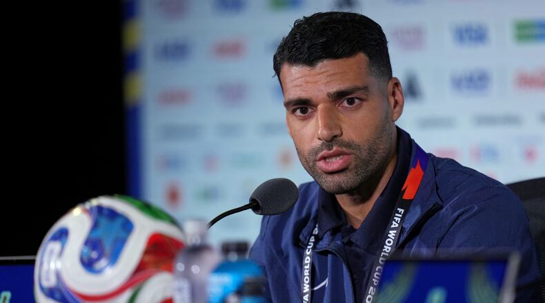 Iran's Mehdi Taremi speaks during a press conference ahead of his FIFA World Cup match against New Zealand in Inglewood, Calif., near Los Angeles, Sunday, June 14, 2026. (AP Photo/Andre Penner)