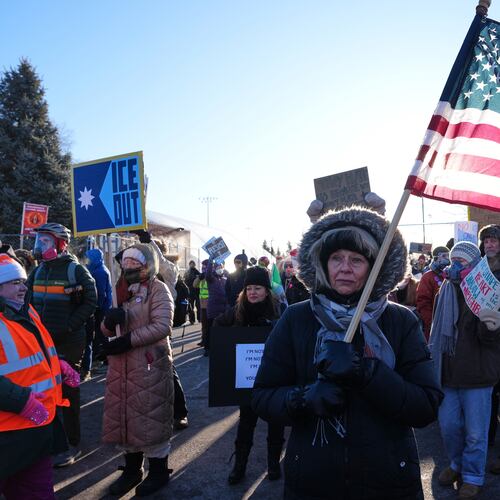 People gather for a protest against ICE outside the Bishop Henry Whipple Federal Building, Friday, Jan. 30, 2026, in Minneapolis. (AP Photo/Adam Gray)
