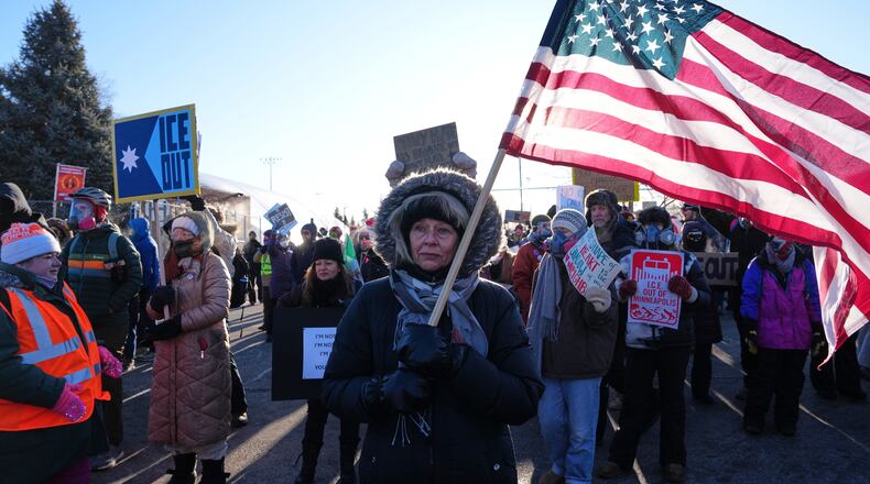 People gather for a protest against ICE outside the Bishop Henry Whipple Federal Building, Friday, Jan. 30, 2026, in Minneapolis. (AP Photo/Adam Gray)