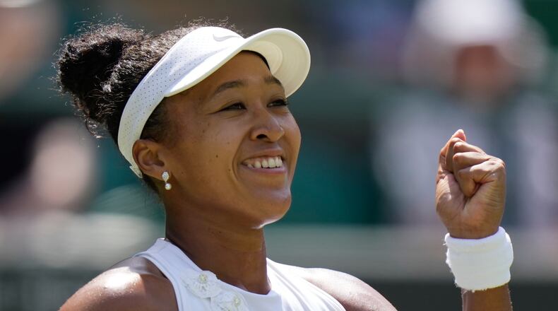 Naomi Osaka of Japan celebrates winning the third round women's singles match against Daria Kasatkina of Australia at the Wimbledon Tennis Championships in London, Friday, July 3, 2026.(AP Photo/Brian Inganga)