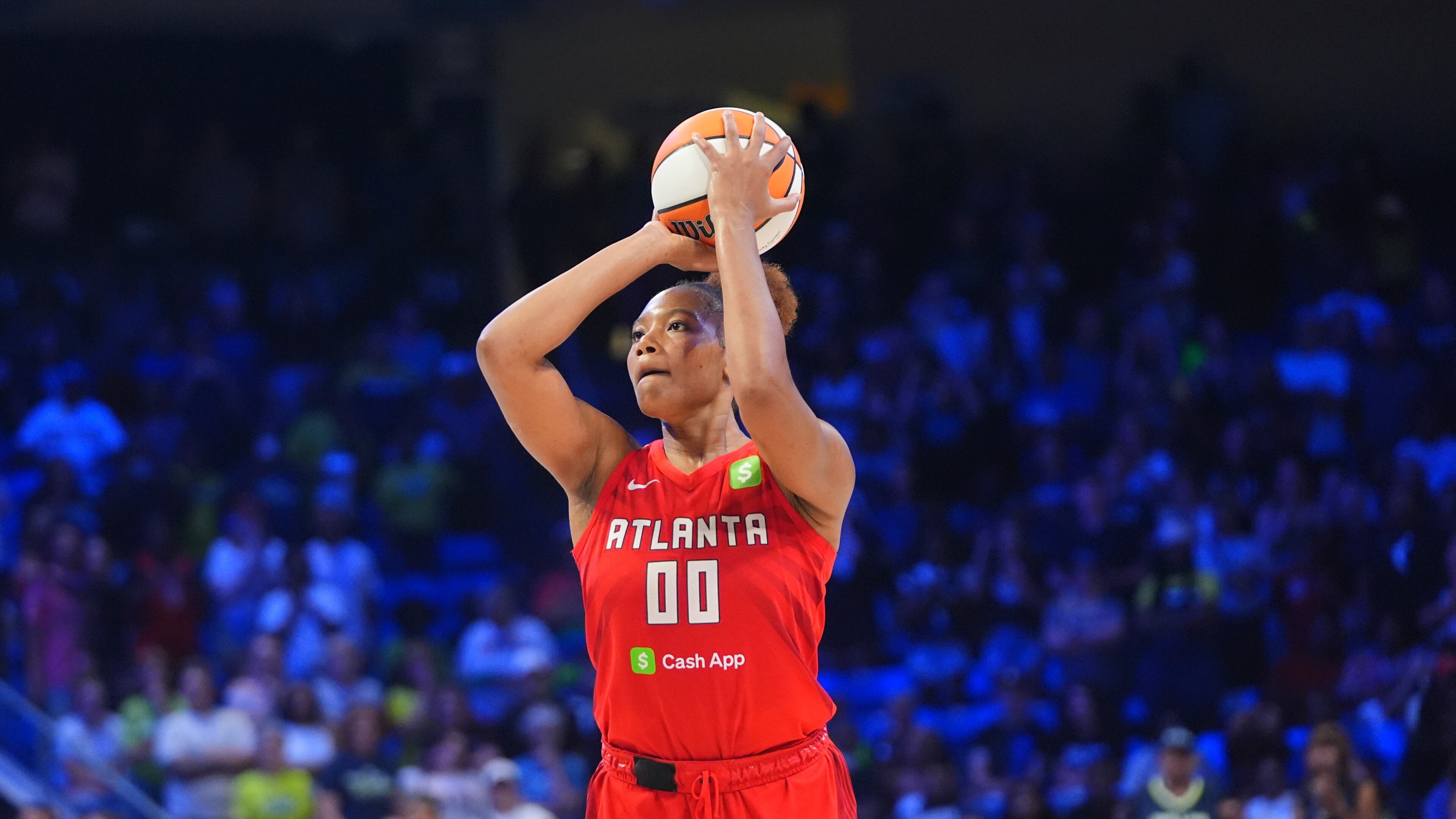 Atlanta Dream forward Naz Hillmon, who finished with 14 points and 13 rebounds in Sunday's win over the Washington Mystics, lines up to shoot a game winning shot during the second half of a WNBA basketball game against the Dallas Wings in Arlington, Texas on July 30, 2025. (AP Photo/LM Otero)