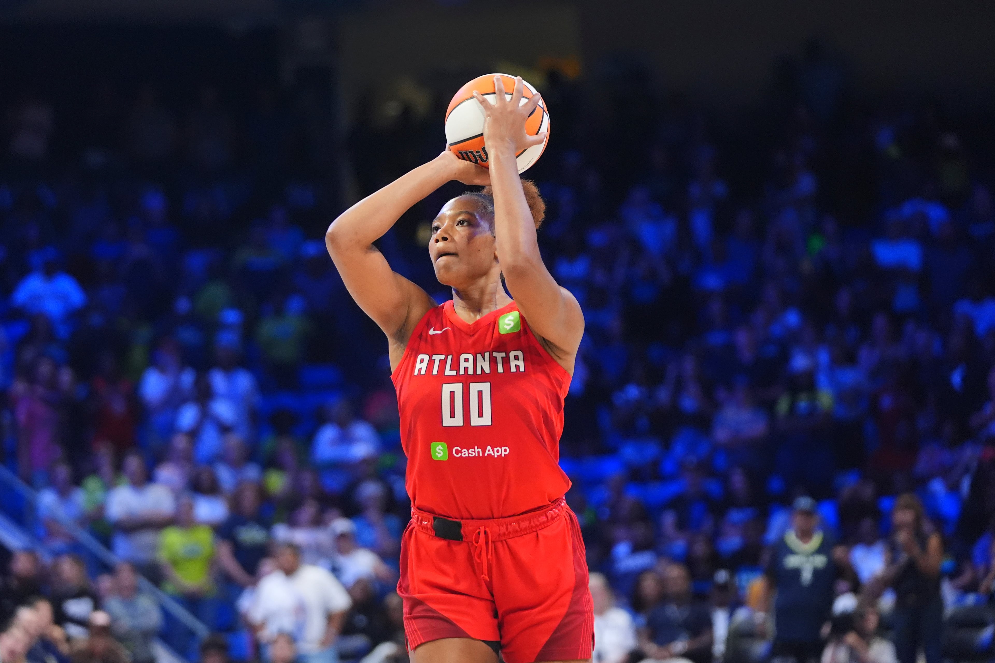 Atlanta Dream forward Naz Hillmon, who finished with 14 points and 13 rebounds in Sunday's win over the Washington Mystics, lines up to shoot a game winning shot during the second half of a WNBA basketball game against the Dallas Wings in Arlington, Texas on July 30, 2025. (AP Photo/LM Otero)