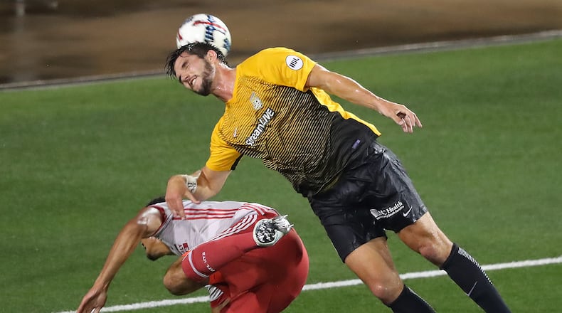 Atlanta United defender Miles Robinson collides with Charleston Battery defender Rorrest Lasso in the Lamar Hunt U.S. Open Cup fourth round at 5th Third Bank Stadium on Wednesday, June 14, 2017, in Kennesaw. Curtis Compton/ccompton@ajc.com
