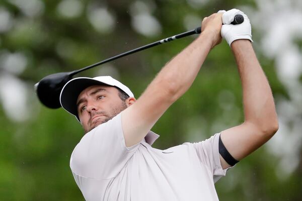 Scottie Scheffler tees off on the 18th hole during the first round of the Houston Open golf tournament, Thursday, March 27, 2025, in Houston. (AP Photo/Michael Wyke)