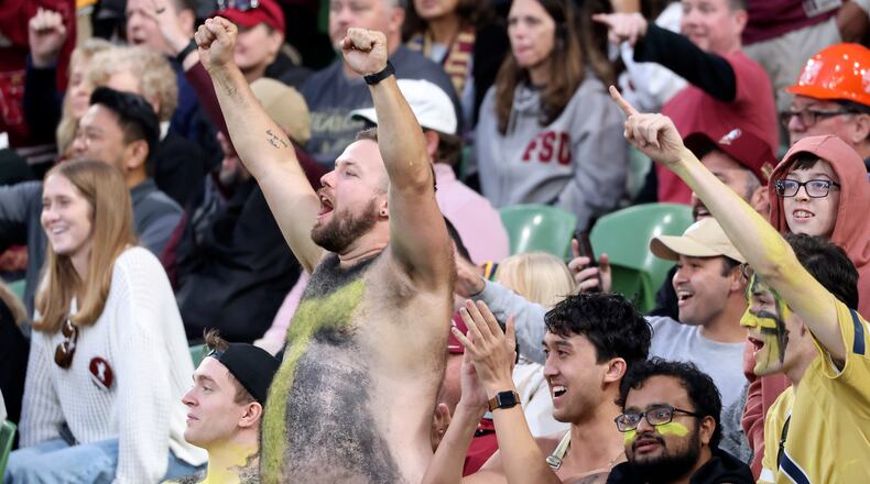 Fans cheer during the NCAA college football game between Georgia Tech and Florida State at the Aviva stadium in Dublin, Saturday, Aug. 24, 2024. (AP Photo/Peter Morrison)