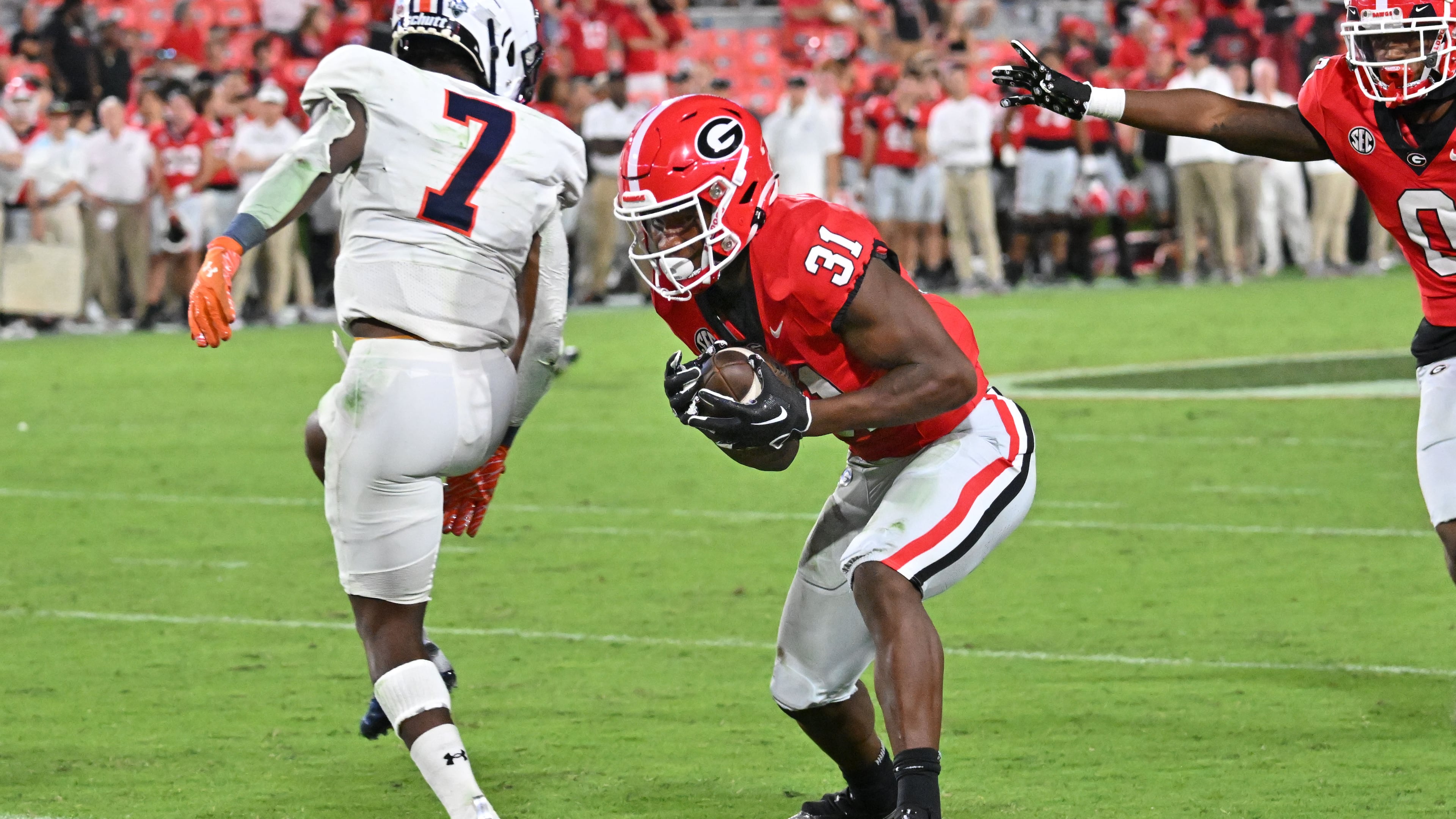 Georgia's running back Kyron Jones (31) intercepts a pass and runs for a touchdown at the end of the fourth quarter in an NCAA football game at Sanford Stadium, Saturday, September 2, 2023, in Athens. Georgia won 48-7 over UT Martin. (Hyosub Shin/AJC)