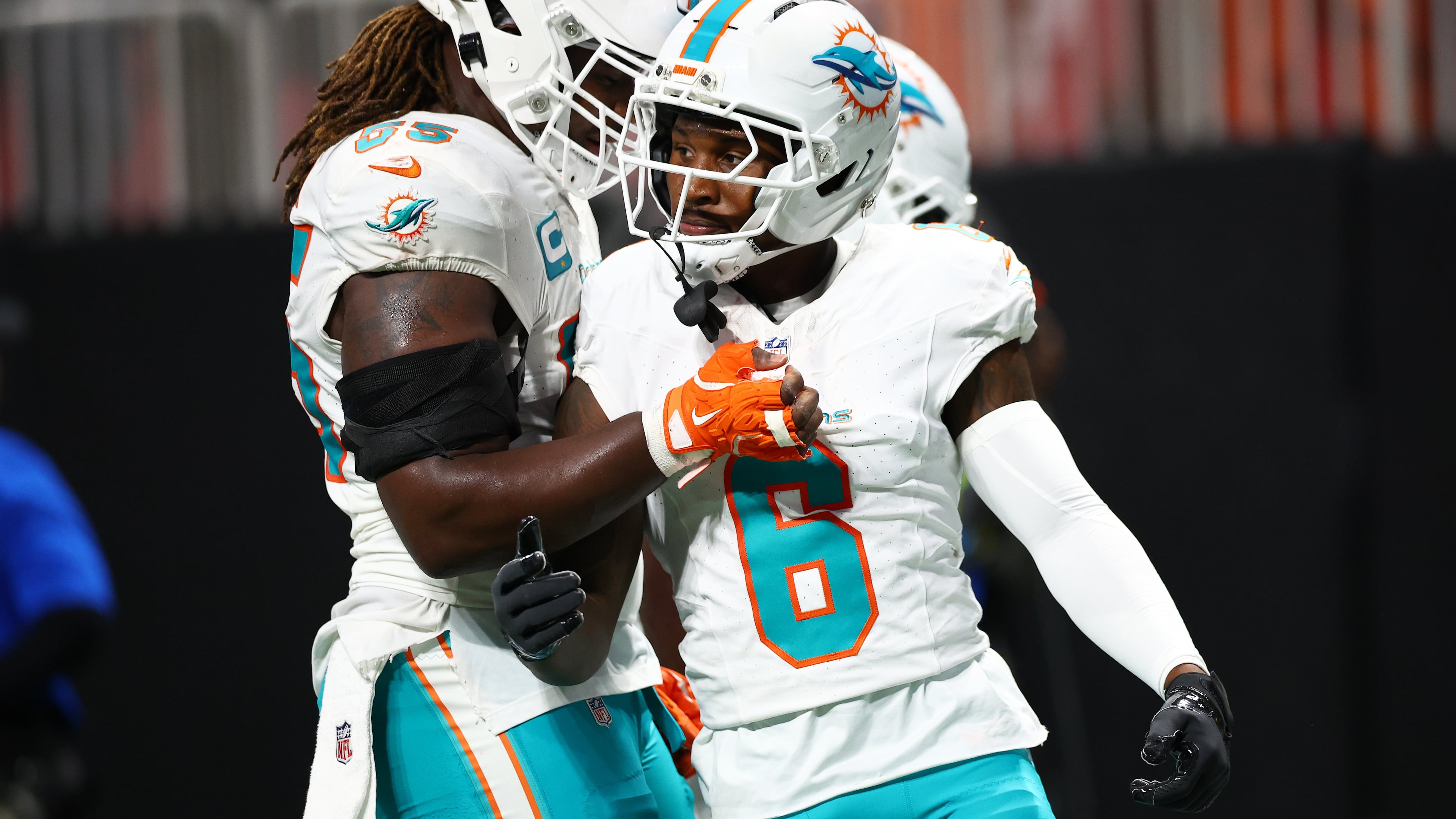 Miami Dolphins wide receiver Malik Washington (6) is congratulated after scoring a touchdown during the first half of an NFL football game against the Atlanta Falcons, Sunday, Oct. 26, 2025, in Atlanta. (AP Photo/Colin Hubbard)