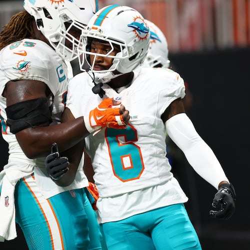 Miami Dolphins wide receiver Malik Washington (6) is congratulated after scoring a touchdown during the first half of an NFL football game against the Atlanta Falcons, Sunday, Oct. 26, 2025, in Atlanta. (AP Photo/Colin Hubbard)